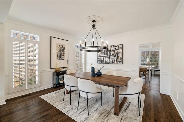 dining space with a healthy amount of sunlight and crown molding