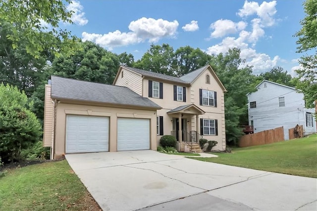 view of front facade with a front lawn and a garage