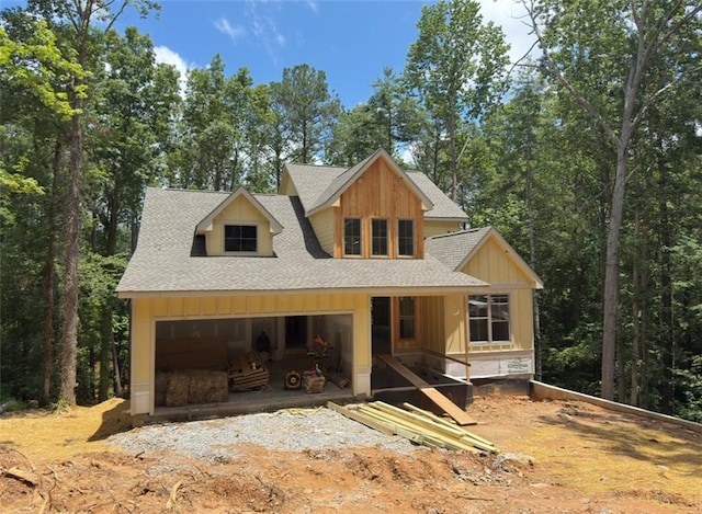 3040 Cypress Cv, Ball Ground, GA 30107 - view of front of house featuring roof with shingles, a garage, and board and batten siding