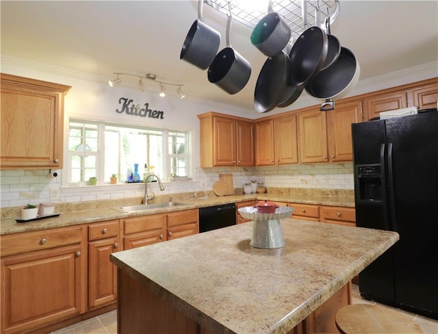 kitchen featuring a sink, tasteful backsplash, black appliances, and ornamental molding