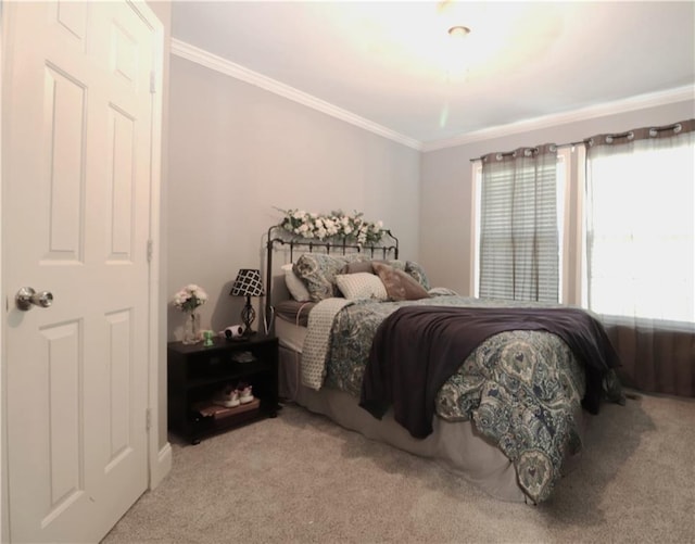 bedroom with light colored carpet and ornamental molding