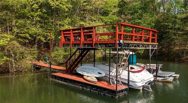 view of dock featuring a water view and a view of trees