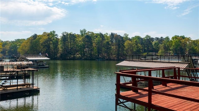 view of dock with a view of trees and a water view