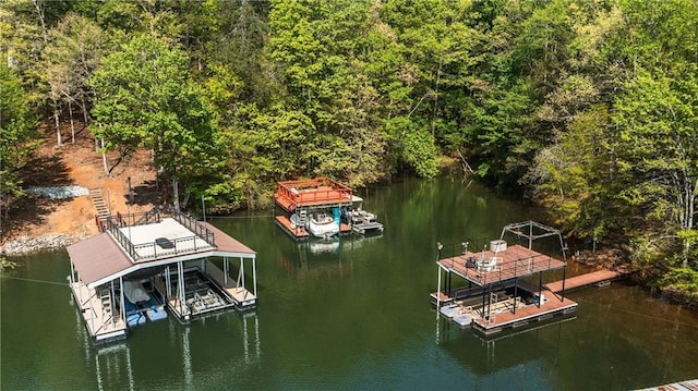 view of dock with boat lift and a water view