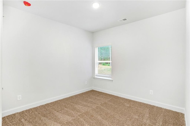 spare room with carpet floors