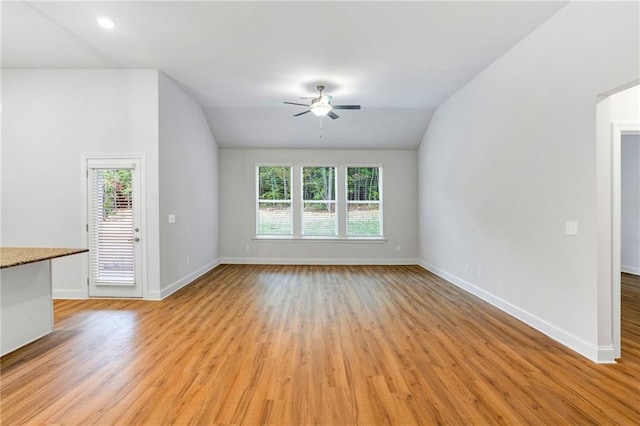 unfurnished living room featuring ceiling fan, lofted ceiling, and light hardwood / wood-style floors