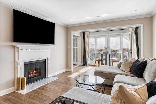 living room with ornamental molding and light wood-type flooring