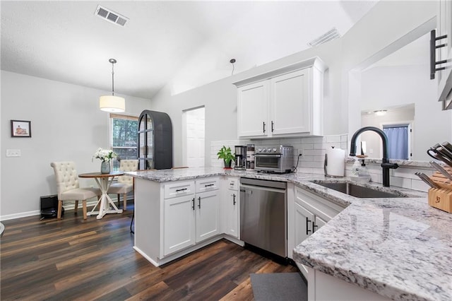 1208 Brandl Dr SW, Marietta, GA 30008 - kitchen featuring a peninsula, dishwasher, a sink, dark wood-style flooring, and lofted ceiling