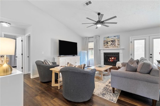1208 Brandl Dr SW, Marietta, GA 30008 - living area with lofted ceiling, dark wood-style flooring, ceiling fan, and a lit fireplace
