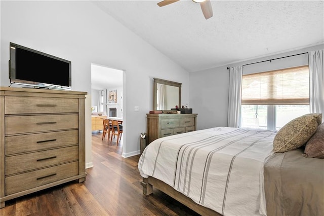1208 Brandl Dr SW, Marietta, GA 30008 - bedroom with vaulted ceiling, dark wood-type flooring, a textured ceiling, and ceiling fan