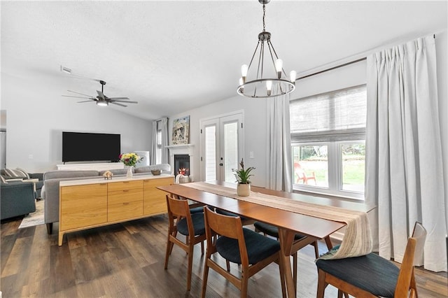 1208 Brandl Dr SW, Marietta, GA 30008 - dining space featuring lofted ceiling, a chandelier, a textured ceiling, dark wood-style floors, and ceiling fan