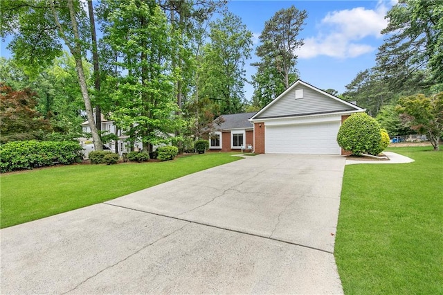 1208 Brandl Dr SW, Marietta, GA 30008 - view of front of home featuring driveway, an attached garage, a front lawn, and brick siding