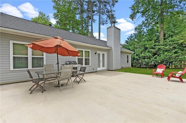 1208 Brandl Dr SW, Marietta, GA 30008 - view of patio with french doors, outdoor dining area, and area for grilling
