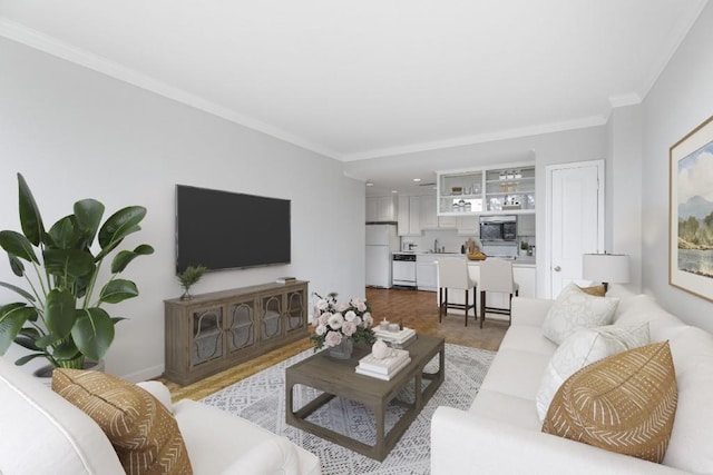 living room with sink and crown molding