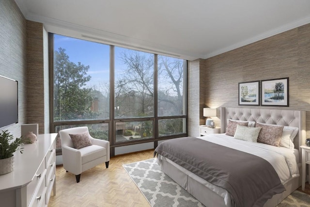 bedroom featuring light parquet floors and ornamental molding