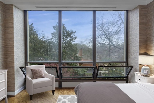 bedroom with floor to ceiling windows and light parquet floors