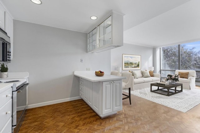 interior space featuring parquet flooring and expansive windows