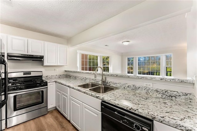 kitchen with white cabinets, dishwasher, gas range, under cabinet range hood, and a sink