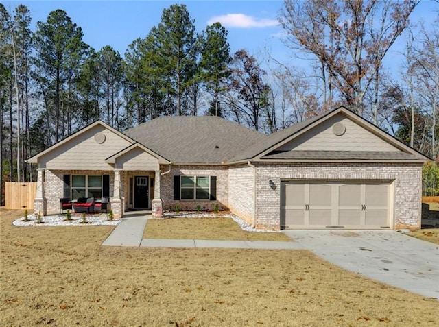 view of front of house featuring a garage and a front lawn