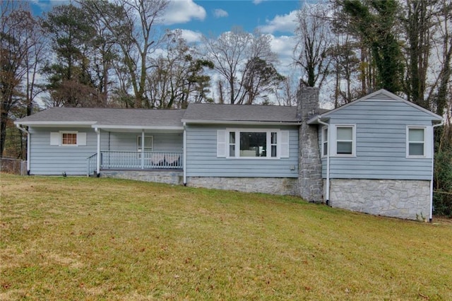 view of front of house with a front lawn and covered porch