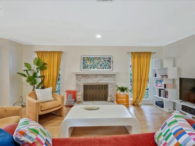 212 Abingdon Way, Atlanta, GA 30328 - living room with wood finished floors, a brick fireplace, ornamental molding, and recessed lighting