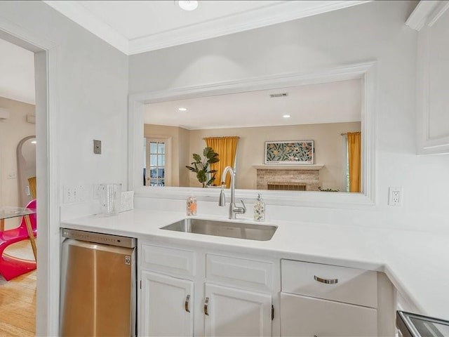 212 Abingdon Way, Atlanta, GA 30328 - kitchen with dishwasher, a sink, white cabinetry, light countertops, and wood finished floors