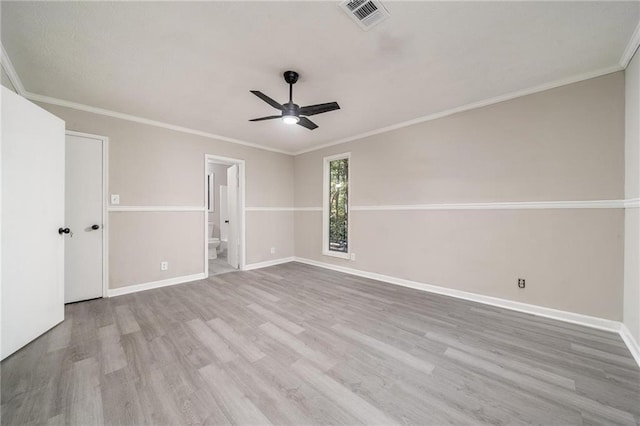 unfurnished room with light wood finished floors, baseboards, and visible vents