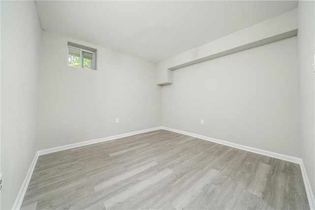 interior space with light wood-style floors and baseboards