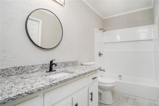 full bath with a textured wall, toilet, vanity, ornamental molding, and shower / bathing tub combination