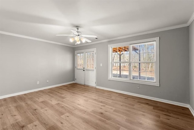 unfurnished room with ornamental molding, ceiling fan, and light wood-type flooring