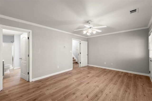 unfurnished bedroom with ornamental molding, ceiling fan, and light wood-type flooring