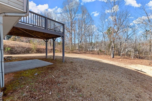 view of yard featuring a wooden deck