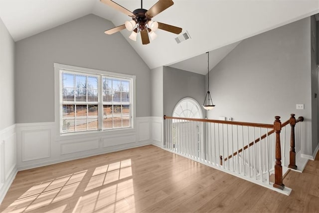 unfurnished room featuring vaulted ceiling, ceiling fan, and light hardwood / wood-style flooring