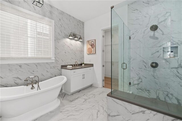 bathroom featuring vanity and a tub to relax in