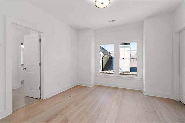 unfurnished room featuring light hardwood / wood-style flooring