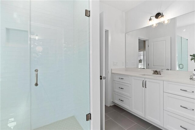 bathroom featuring vanity, an enclosed shower, tile patterned flooring, and toilet