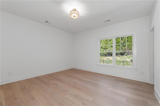 unfurnished room featuring light hardwood / wood-style flooring