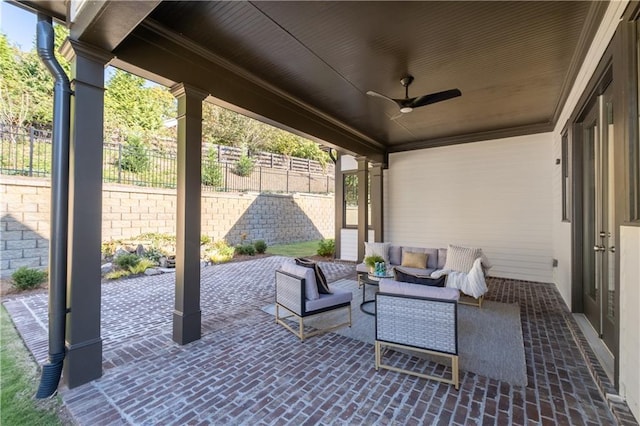 view of patio featuring ceiling fan and an outdoor living space