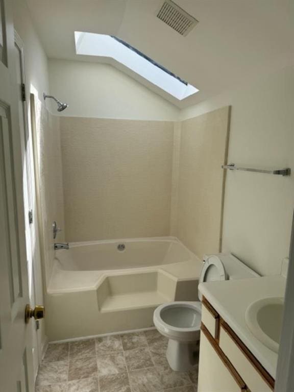 full bathroom with washtub / shower combination, visible vents, vanity, and toilet