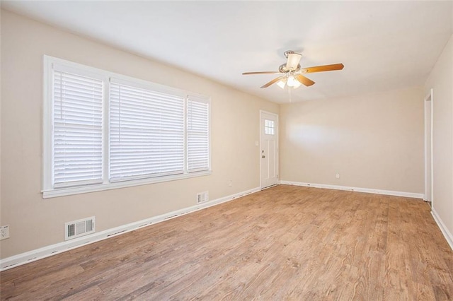 unfurnished room with ceiling fan and light hardwood / wood-style flooring