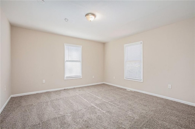 empty room with carpet flooring