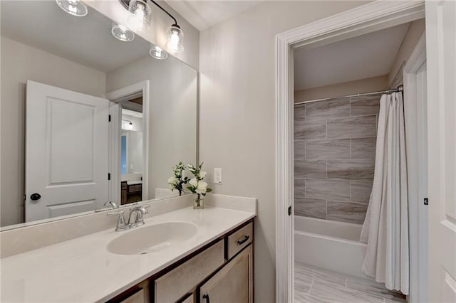 bathroom featuring vanity and shower / bath combination with curtain