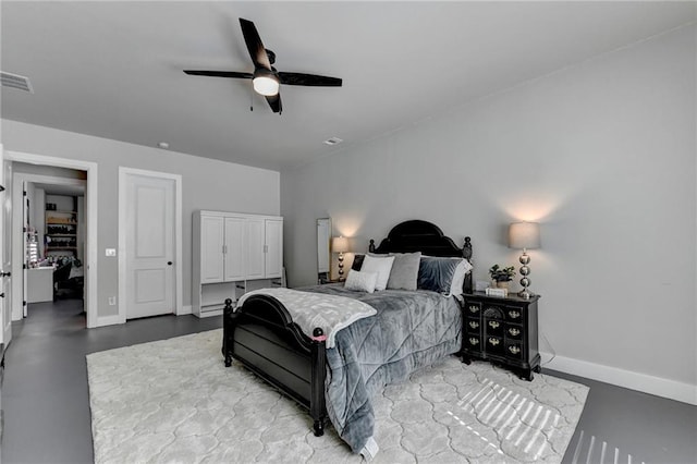 bedroom featuring concrete flooring and ceiling fan