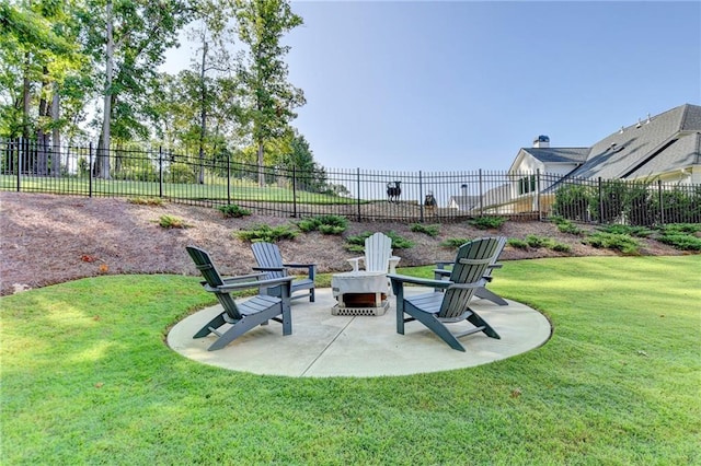 view of yard featuring a patio and an outdoor fire pit