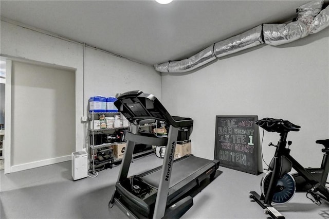 exercise area featuring concrete flooring