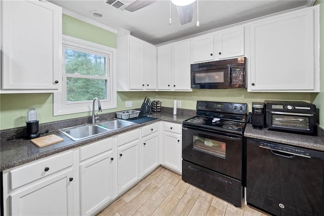 kitchen featuring black appliances, white cabinets, sink, light hardwood / wood-style flooring, and ceiling fan