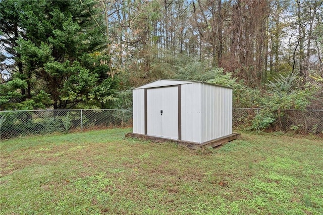 view of outbuilding with a yard