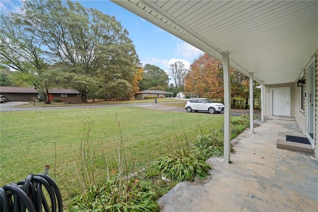 view of yard featuring covered porch