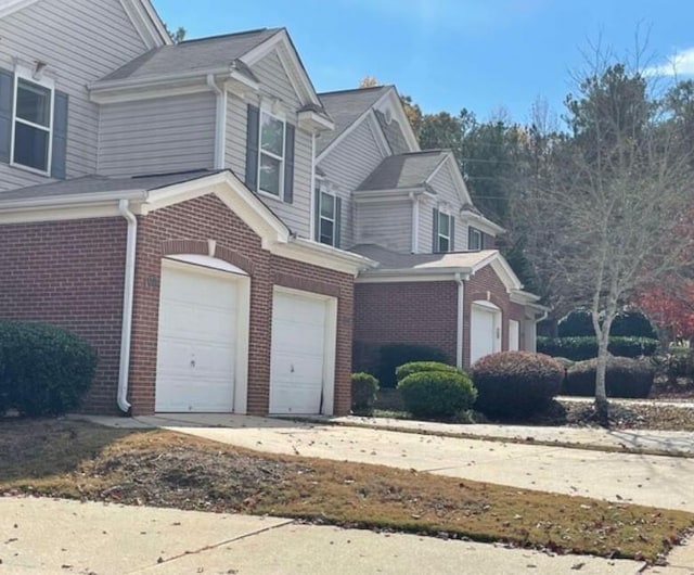 view of side of home with a garage