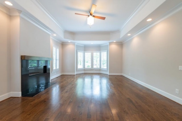 22 Mount Paran Rd, Atlanta, GA 30327 - unfurnished living room with wood finished floors, a glass covered fireplace, a raised ceiling, a ceiling fan, and baseboards
